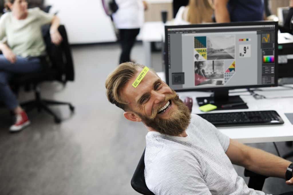 Happy hipster at work